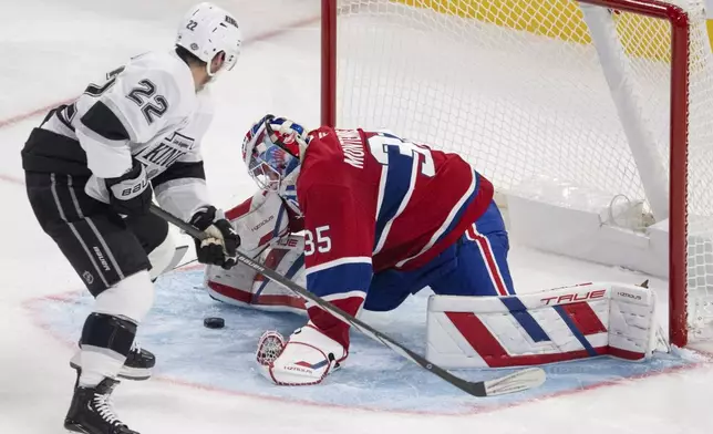 Montreal Canadiens goaltender Sam Montembeault (35) makes the save on Los Angeles Kings Kevin Fiala (22) during the third period of an NHL hockey game, Thursday, Oct. 17, 2024 in Montreal. (Ryan Remiorz/The Canadian Press via AP)