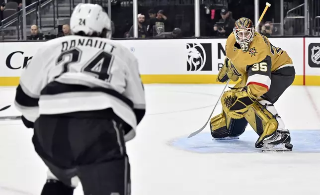 Vegas Golden Knights goaltender Ilya Samsonov (35) defends the net against Los Angeles Kings center Phillip Danault (24) during the first period of an NHL hockey game Tuesday, Oct. 22, 2024, in Las Vegas. (AP Photo/David Becker)