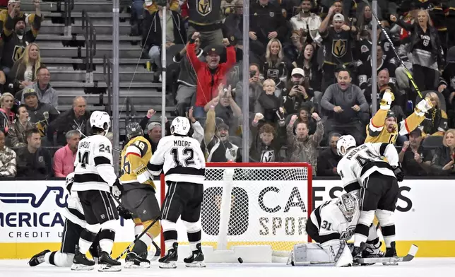 Vegas Golden Knights right wing Mark Stone, right, reacts after a goal by center Tomas Hertl (48) against the Los Angeles Kings during the first period of an NHL hockey game Tuesday, Oct. 22, 2024, in Las Vegas. (AP Photo/David Becker)