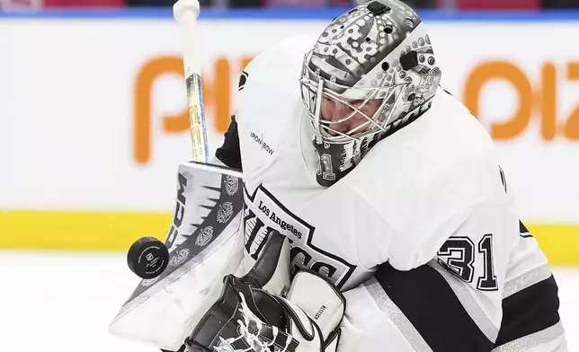 Los Angeles Kings goaltender David Rittich (31) makes a save against the Toronto Maple Leafs during the second period of an NHL hockey game, Wednesday, Oct. 16, 2024 in Toronto. (Frank Gunn/The Canadian Press via AP)