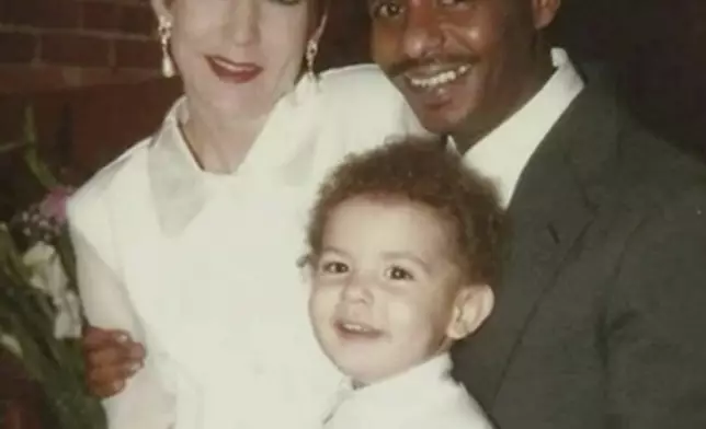 In this photo provided by Mike Davis, right, he stands with his wife, Laura Lynn Davis, and their son, Solomon, in Augusta, Ga, on Feb. 13, 1997. Mike was adopted as a boy an American soldier stationed in Ethiopia who brought him to the U.S. He was deported to Ethiopia two decades ago, and now lives in a room with a mud floor and running water only once a month and even when the tap works, it isn't safe to drink. (Courtesy Mike Davis via AP)