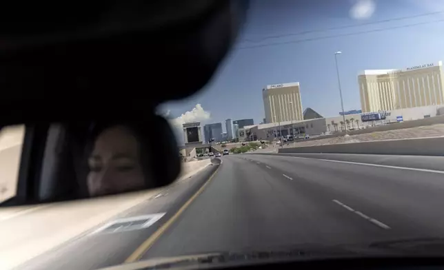 Buttons, an adoptee from Iran who grew up to find out she was never naturalized, drives through Las Vegas, Wednesday, June 26, 2024. She had hope. She's lost that now. For a decade, legislation has been introduced year after year, it dies, and nothing happens. (AP Photo/David Goldman)