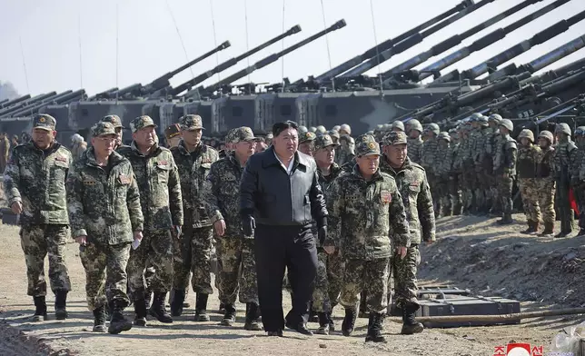 FILE - In this photo provided by the North Korean government, North Korean leader Kim Jong Un, center, supervises artillery firing drills in North Korea on March 7, 2024. (Korean Central News Agency/Korea News Service via AP, File)
