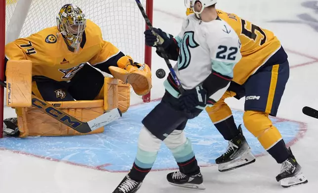 Nashville Predators goaltender Juuse Saros (74) blocks a shot on goal during the third period of an NHL hockey game against the Seattle Kraken, Tuesday, Oct. 15, 2024, in Nashville, Tenn. (AP Photo/George Walker IV)