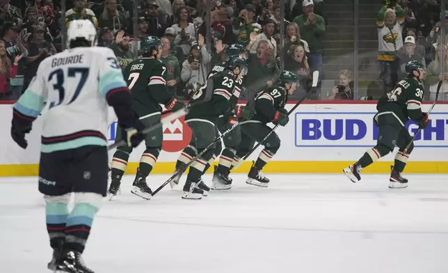 Minnesota Wild right wing Mats Zuccarello (36) skates toward the bench after scoring during the first period of an NHL hockey game against the Seattle Kraken, Saturday, Oct. 12, 2024, in St. Paul, Minn. (AP Photo/Abbie Parr)