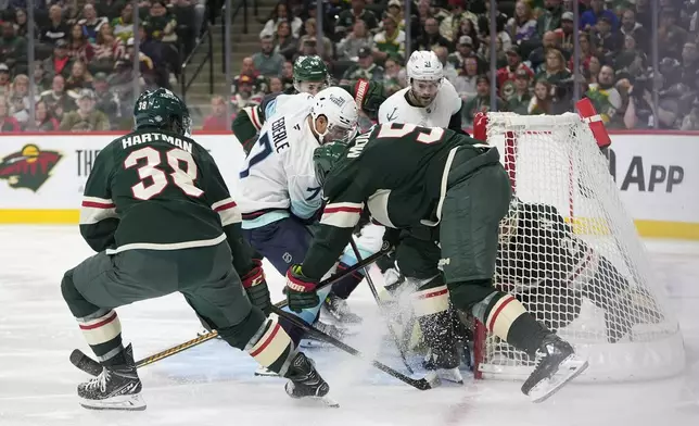 Seattle Kraken right wing Jordan Eberle (7) scores a goal during the second period of an NHL hockey game against the Minnesota Wild, Saturday, Oct. 12, 2024, in St. Paul, Minn. (AP Photo/Abbie Parr)