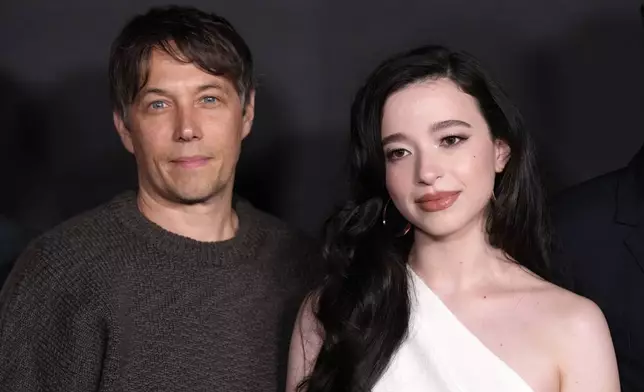 Sean Baker, left, writer/director of "Anora," and cast member Mikey Madison pose together at the premiere of the film, Tuesday, Oct. 1, 2024, at the Vista Theatre in Los Angeles. (AP Photo/ Chris Pizzello)