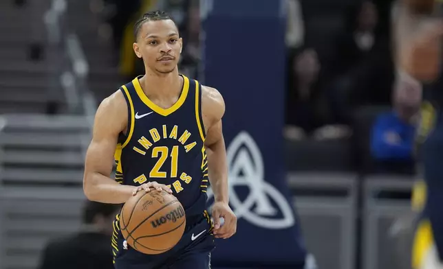 FILE - Indiana Pacers' Isaiah Wong dribbles during the second half of an NBA basketball game against the Brooklyn Nets, April 1, 2024, in Indianapolis. (AP Photo/Darron Cummings, File)