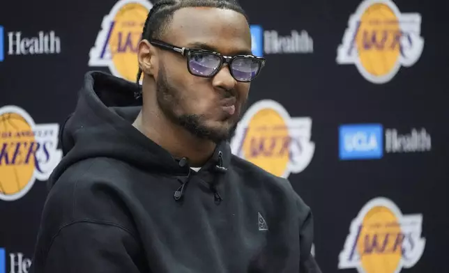 FILE - Bronny James takes questions from the media as he's introduced as the Los Angeles Lakers draft pick during the NBA basketball team's news conference in El Segundo, Calif., Tuesday, July 2, 2024. (AP Photo/Damian Dovarganes, File)