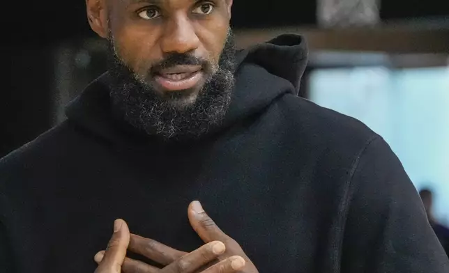 FILE - Los Angeles Lakers' LeBron James attends a news conference to introduce the NBA basketball team's NBA draft picks, Bronny James and Dalton Knecht, Tuesday, July 2, 2024, in El Segundo, Calif. (AP Photo/Damian Dovarganes, File)