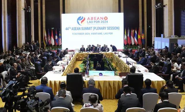 Laos Prime Minister Sonexay Siphandone, center, speaks during 44th the Association of Southeast Asian Nations (ASEAN) Minister in Vientiane, Laos, Wednesday, Oct. 9, 2024. (AP Photo/Sakchai Lalit)