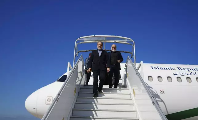 In this photo released by Iranian Foreign Ministry, Iranian Foreign Minister Abbas Araghchi steps out of his plane upon arrival at Beirut, Lebanon, Friday, Oct. 4, 2024. (Iranian Foreign Ministry via AP)