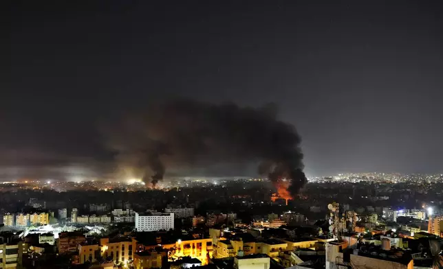 Flame and smoke rises from Israeli airstrikes on Dahiyeh, in the southern suburb of Beirut, Lebanon, early Sunday, Oct. 27, 2024. (AP Photo/Hussein Malla)