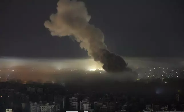 Smoke rises from an Israeli airstrike on Dahiyeh, in the southern suburb of Beirut, Lebanon, early Sunday, Oct. 27, 2024. (AP Photo/Hussein Malla)