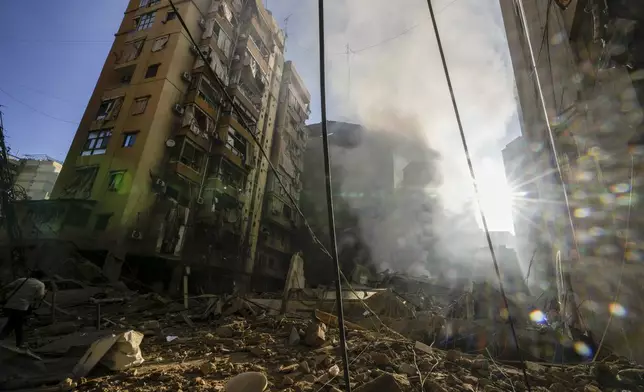 Smoke rises from the site of an Israeli airstrike in Dahiyeh, Beirut, Lebanon, Thursday, Oct. 3, 2024. (AP Photo/Hassan Ammar)