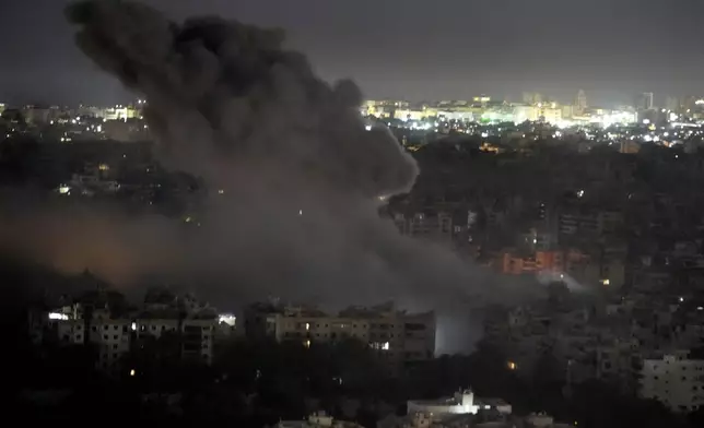 Smoke rises from an Israeli airstrike on Dahiyeh, in the southern suburb of Beirut, Lebanon, early Sunday, Oct. 27, 2024. (AP Photo/Hussein Malla)