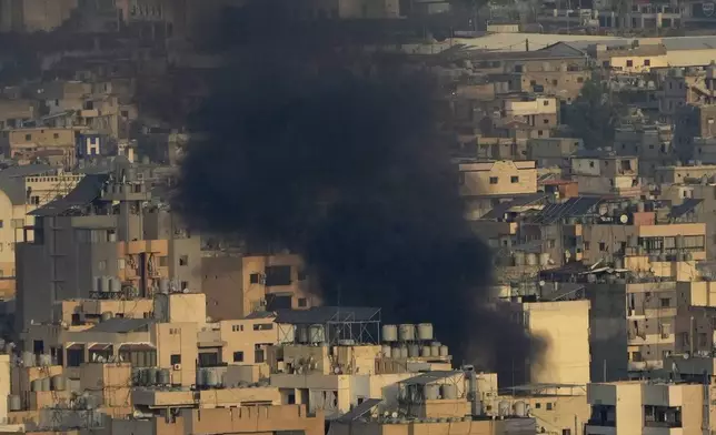 Smoke rise from Israeli airstrikes on Dahiyeh, Beirut's southern suburbs, Lebanon, Wednesday, Oct. 16, 2024. (AP Photo/Hussein Malla)