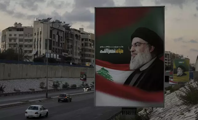 Billboards with a picture of the late Lebanon's Hezbollah leader Sayyed Hassan Nasrallah are displayed on a Beirut airport highway, Saturday, Oct. 5, 2024. (AP Photo/Bilal Hussein)