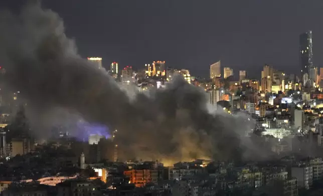 Smoke rises from Israeli airstrikes on Dahiyeh, in the southern suburb of Beirut, Lebanon, early Sunday, Oct. 20, 2024. (AP Photo/Hussein Malla)