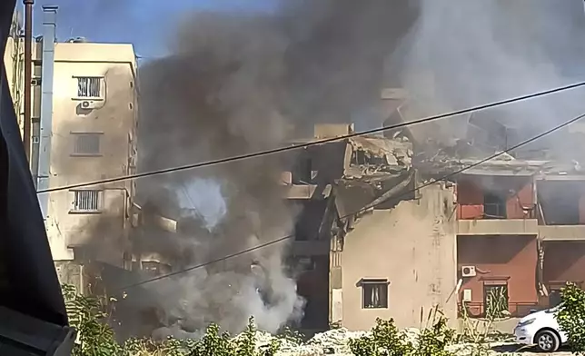 Smoke rises from a building hit by an Israeli airstrike, in the southern port city of Sidon, Lebanon, Sunday, Oct. 27, 2024. (AP Photo/Mohammed Zaatari)