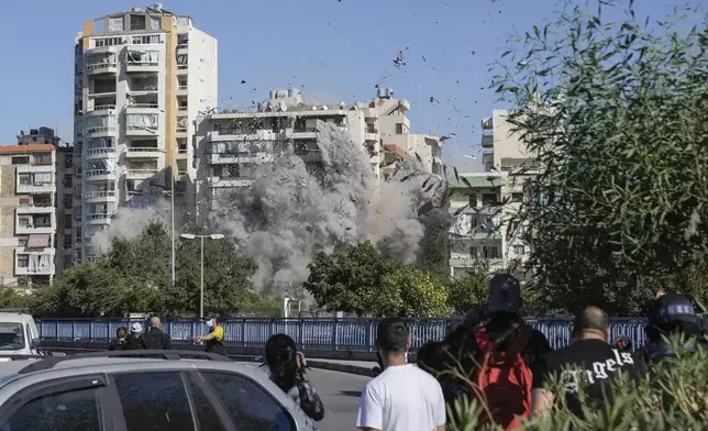 Smoke rises from a building that was hit by an Israeli airstrike in Ghobeiri, Beirut, Lebanon, Tuesday, Oct. 22, 2024. (AP Photo/Bilal Hussein)