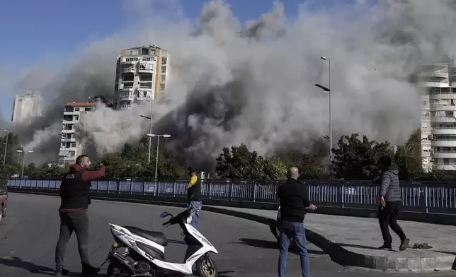 Smoke rises from a building that was hit by an Israeli airstrike in Ghobeiri, Beirut, Lebanon, Tuesday, Oct. 22, 2024. (AP Photo/Bilal Hussein)