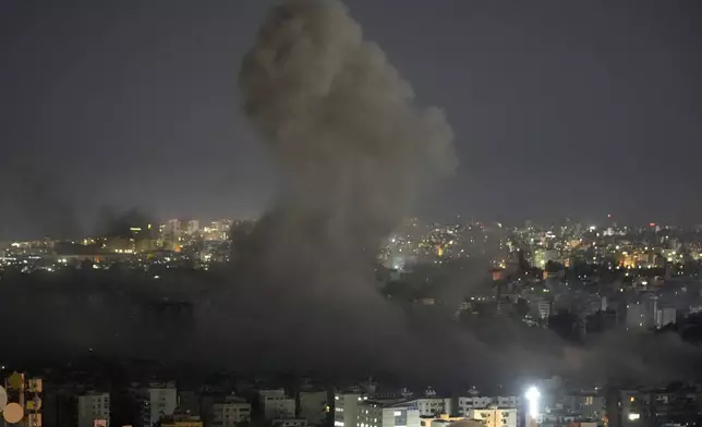 Smoke rises from an Israeli airstrike on Dahiyeh, in the southern suburb of Beirut, Lebanon, early Friday, Oct. 25, 2024. (AP Photo/Hussein Malla)