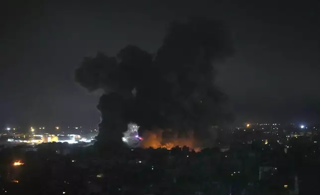 Flames and smoke rise from Israeli airstrikes in Dahiyeh, Beirut, Lebanon, Friday, Oct. 4, 2024. (AP Photo/Hussein Malla)