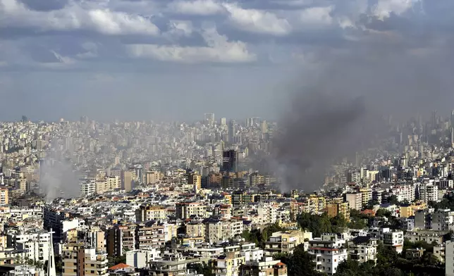 Smoke rises from neighbourhoods hit by Israeli airstrikes in Dahieh, Beirut, Lebanon, Wednesday, Oct. 2, 2024. (AP Photo/Hussein Malla)