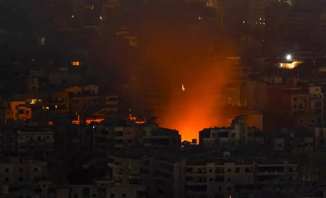 Smoke and fire rise from the site of an Israeli airstrike in Dahiyeh, Beirut, Lebanon, Friday, Oct. 25, 2024. (AP Photo/Hassan Ammar)