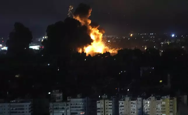 Flames rise from Israeli airstrikes in Dahiyeh, Beirut, Lebanon, Friday, Oct. 4, 2024. (AP Photo/Hussein Malla)