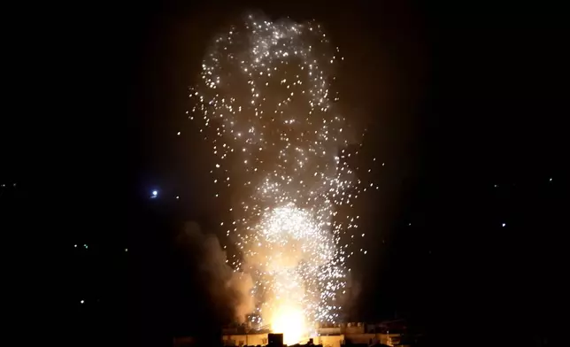 Flames and smoke rise from an Israeli airstrike in Dahiyeh, Beirut, Lebanon, early Sunday, Oct. 6, 2024. (AP Photo/Hussein Malla)