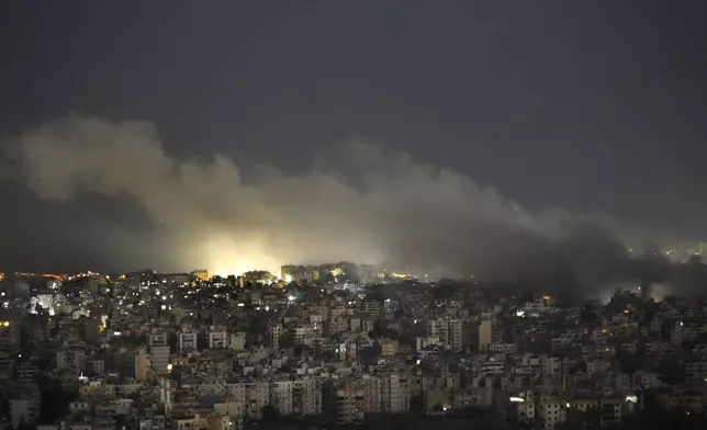 Smoke rises from an Israeli airstrike on Dahiyeh, in the southern suburb of Beirut, Lebanon, Sunday, Oct. 20, 2024. (AP Photo/Hussein Malla)