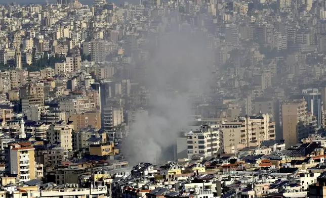 Smoke rises a neighborhood that was hit by an Israeli airstrike in Dahieh, Beirut, Lebanon, Wednesday, Oct. 2, 2024. (AP Photo/Hussein Malla)