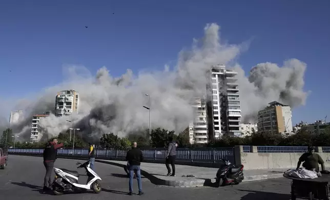 Smoke rises from a building that was hit by an Israeli airstrike in Ghobeiri, Beirut, Lebanon, Tuesday, Oct. 22, 2024. (AP Photo/Bilal Hussein)