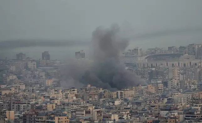 Smoke rise from Israeli airstrikes on Dahiyeh, Beirut's southern suburbs, Lebanon, Wednesday, Oct. 16, 2024. (AP Photo/Hussein Malla)