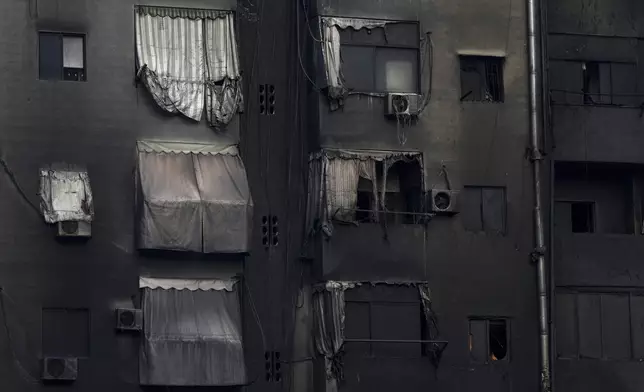 A burnt out building at the site of an Israeli airstrike in Beirut's southern suburb, Lebanon, Tuesday, Oct. 1, 2024. (AP Photo/Hassan Ammar)