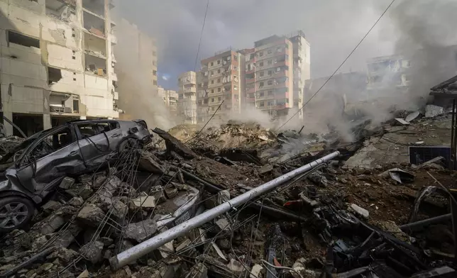 Smoke rises from the site of an Israeli airstrike in Beirut's southern suburb, Lebanon, Tuesday, Oct. 1, 2024. (AP Photo/Hassan Ammar)