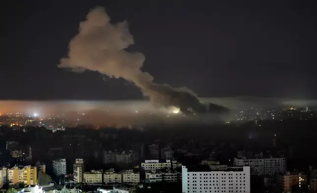 Smoke rises from an Israeli airstrike on Dahiyeh, in the southern suburb of Beirut, Lebanon, early Sunday, Oct. 27, 2024. (AP Photo/Hussein Malla)