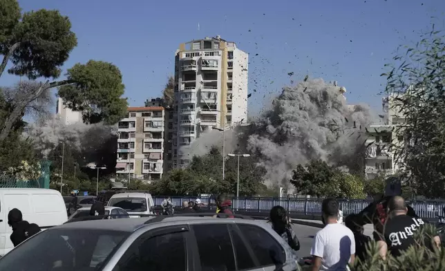 Smoke rises from a building that was hit by an Israeli airstrike in Ghobeiri, Beirut, Lebanon, Tuesday, Oct. 22, 2024. (AP Photo/Bilal Hussein)