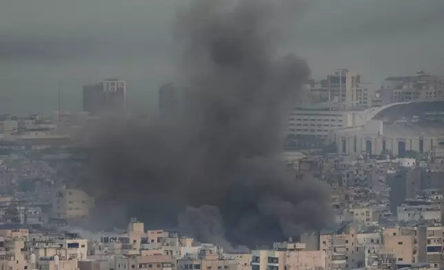 Smoke rise from Israeli airstrikes on Dahiyeh, Beirut's southern suburbs, Lebanon, Wednesday, Oct. 16, 2024. (AP Photo/Hussein Malla)