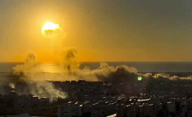 Smoke rises from Israeli airstrikes on Dahiyeh, as the sunset in the southern suburb of Beirut, Lebanon, Saturday, Oct. 19, 2024. (AP Photo/Hussein Malla)