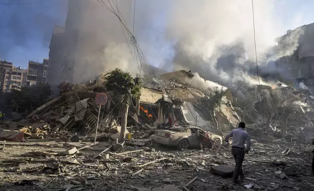 Smoke rises from the site of an Israeli airstrike in Dahiyeh, Beirut, Lebanon, Thursday, Oct. 3, 2024. (AP Photo/Hassan Ammar)