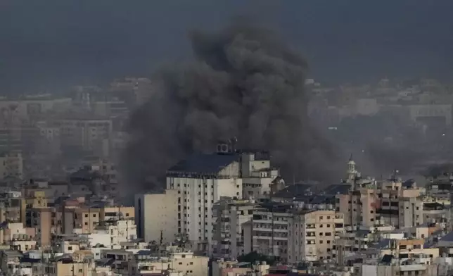 Smoke rises from Israeli airstrikes on Dahiyeh, in the southern suburb of Beirut, Lebanon, early Sunday, Oct. 20, 2024. (AP Photo/Hussein Malla)