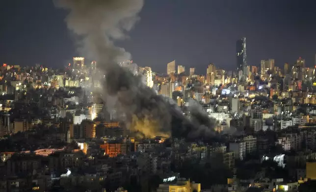 Smoke rises from an Israeli airstrikes on Dahiyeh, in the southern suburb of Beirut, Lebanon, early Sunday, Oct. 20, 2024. (AP Photo/Hussein Malla)