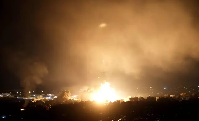 Flames rise from Israeli airstrikes in Dahiyeh, Beirut, Lebanon, Friday, Oct. 4, 2024. (AP Photo/Hussein Malla)