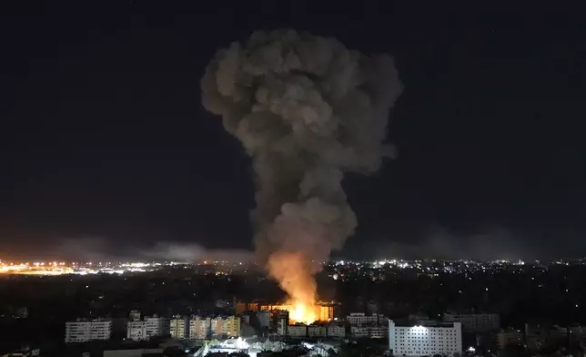 Flames and smoke rise from buildings hit by Israeli airstrikes on Dahiyeh, in the southern suburb of Beirut, Wednesday, Oct. 23, 2024. (AP Photo/Hussein Malla)