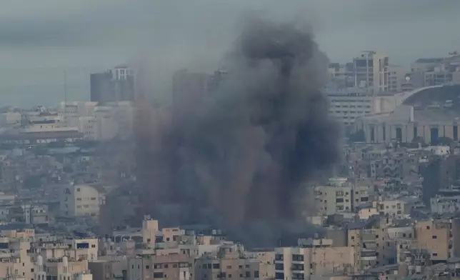 Smoke rise from Israeli airstrikes on Dahiyeh, Beirut's southern suburbs, Lebanon, Wednesday, Oct. 16, 2024. (AP Photo/Hussein Malla)