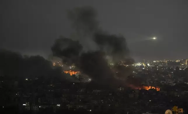 Smoke rises after Israeli airstrikes in Dahiyeh, Beirut, Lebanon, Saturday, Oct. 5, 2024. (AP Photo/Bilal Hussein)