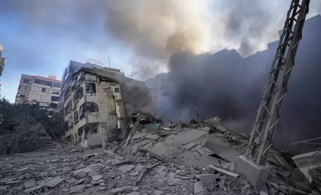 Smoke rises from the site of an Israeli airstrike in Dahiyeh, Beirut, Lebanon, Thursday, Oct. 3, 2024. (AP Photo/Hassan Ammar)